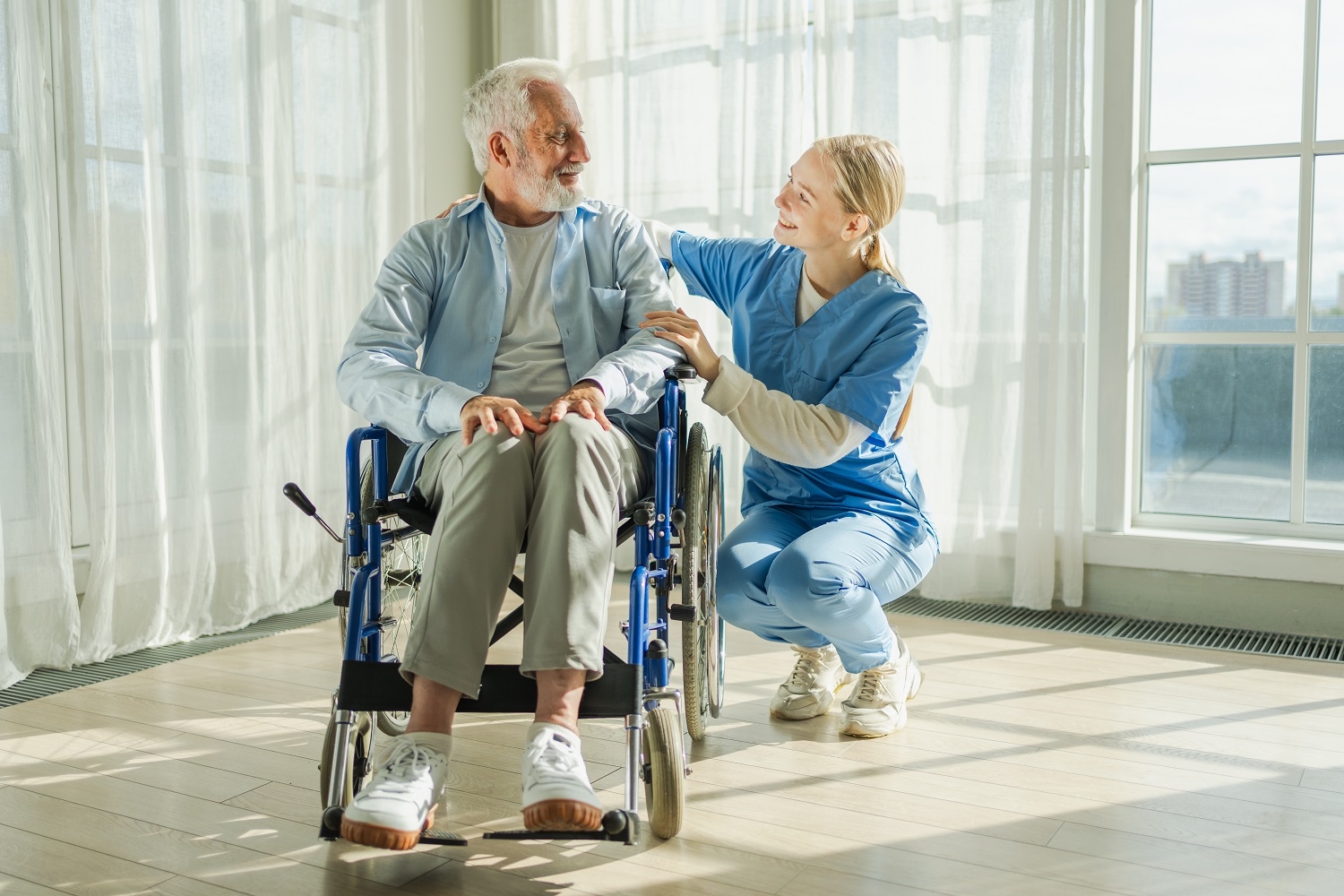 Help support retirement healthcare. Nurse helping old man in wheelchair. Patient and woman in nursing home for medical caregiver, Nurse taking care of paralyzed man in chair for people with disability
